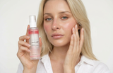 Nano_Banana_2_-_A_young_beautiful_woman_holding_a_pink_skincare_serum_mist_bottle_shown_in_the_refer_4 - Stylebox